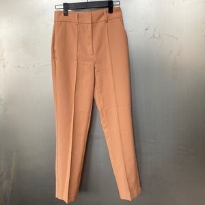 Women’s dress pants. Size 0. Worn once. Rusted pink color. Pleated design.